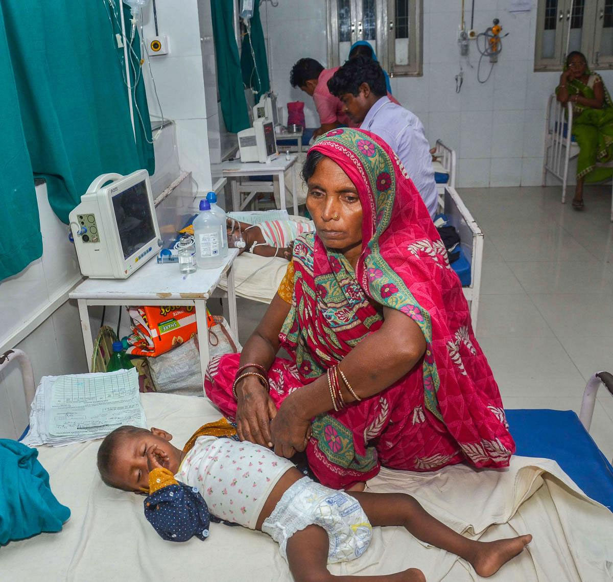 A child showing symptoms of Acute Encephalitis Syndrome (AES) being treated at a hospital in Muzaffarpur, Saturday, June 22, 2019. Three more children with symptoms of Acute Encephalitis Syndrome (AES) died at a hospital in Bihar's Muzaffarpur district Friday taking the toll to 139. (PTI Photo) 