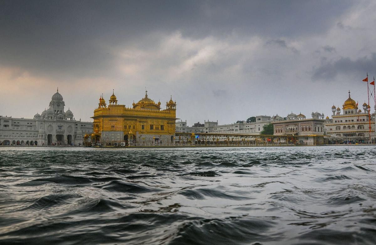 Rain clouds hover over Harmandir Sahib (Golden Temple) ahead of the onset of monsoon, in Amritsar, Thursday, July 4, 2019. (PTI Photo)