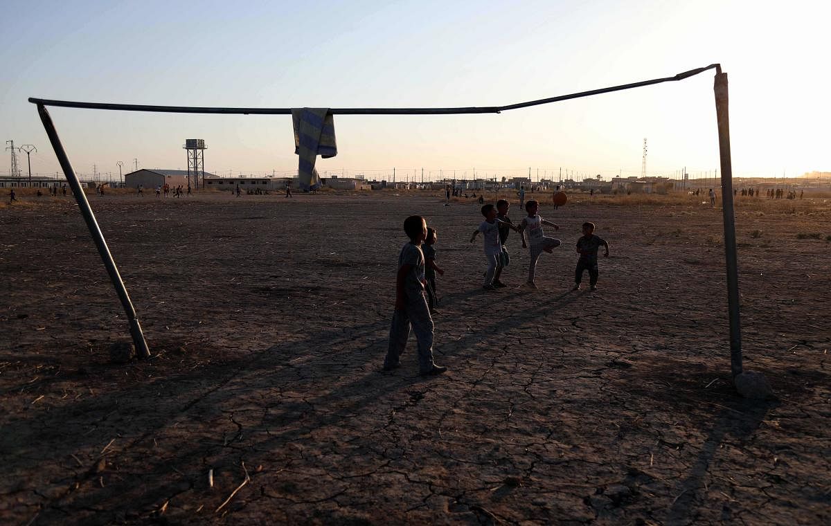 Displaced Iraqis play football at al-Khazir camp for the internally displaced, located between Arbil and Mosul. (Photo AFP)