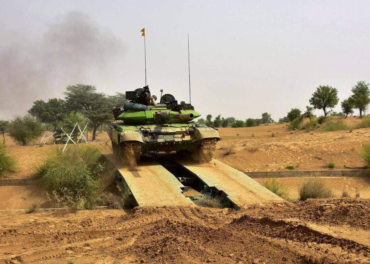 Army tanks participate in 'Vijay Prahar' military exercise at Mahajan Field Firing Range near Bikaner in Rajasthan on Wednesday. PTI photo.