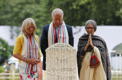 U.S. Vice President Joe Biden (C), his wife Jill (L), and Tara Gandhi,  the granddaughter of Mahatma Gandhi, pay homage at the Mahatma Gandhi  memorial  at Gandhi Smriti, in New Delhi July 22, 2013. Biden is on a  four-day visit to India. REUTERS