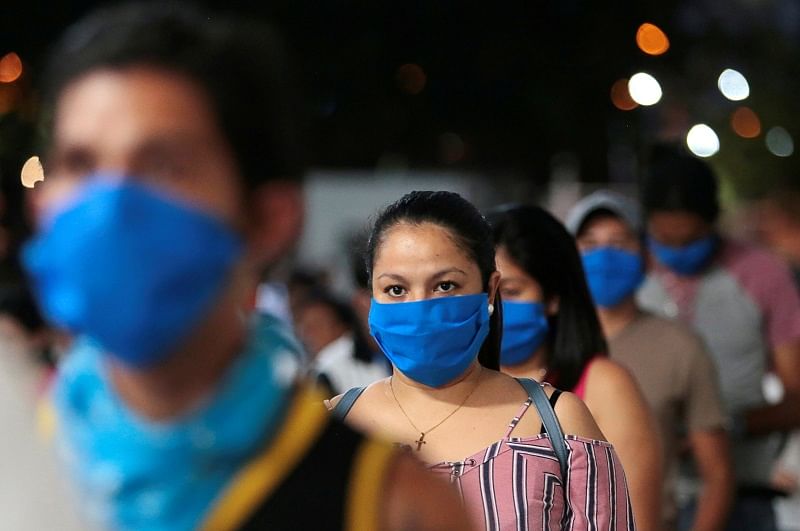 Fans wearing face masks while entering the arena, despite most sport being cancelled around the world as the spread of the coronavirus disease (COVID-19) continues. (Reuters Photo)