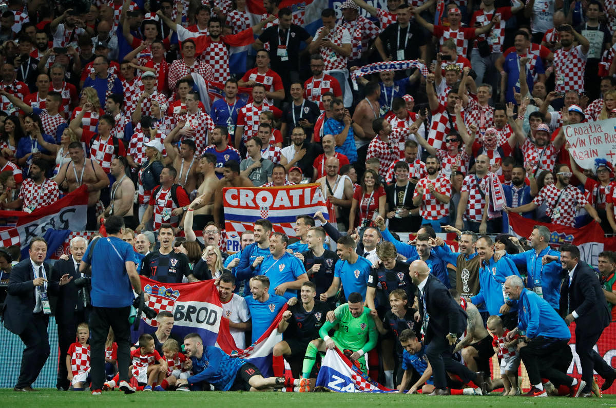 Croatian players celebrate after beating England 2-1 in the World Cup semi-final. (Reuters Photo)