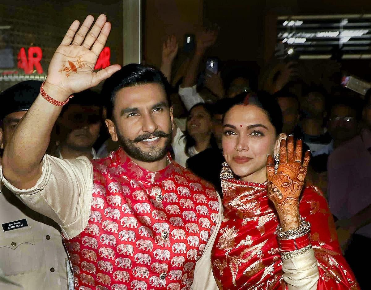 Newly-wed Bollywood stars Deepika Padukone and Ranveer Singh, who recently tied knot in a private ceremony at Lake Como in Italy, on their arrival in Mumbai. PTI photo 
