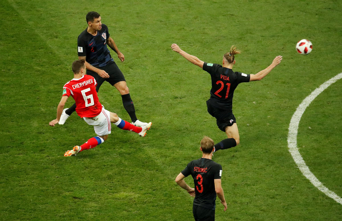  Russia's Denis Cheryshev scores their first goal. REUTERS