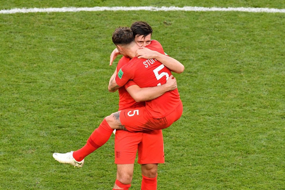England's defender Harry Maguire (L) celebrates with England's defender John Stones after winning the Russia 2018 World Cup quarter-final football match between Sweden and England at the Samara Arena in Samara. AFP photo