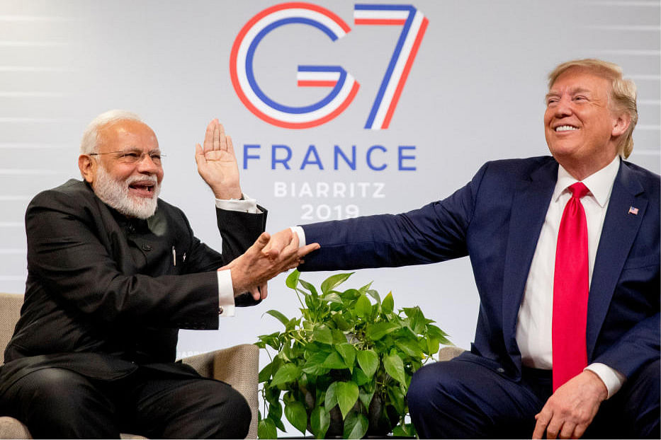 Indian Prime Minister Narendra Modi, left, slaps the hand of President Donald Trump as they share a laugh during a bilateral meeting at the G-7 summit in Biarritz, France, Monday, Aug. 26, 2019. (AP/PTI)