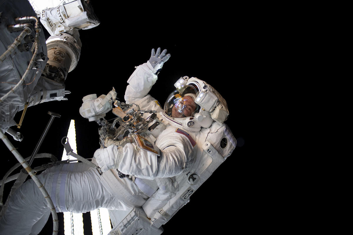 This NASA photo released on August 27, 2019 shows West Point graduate, physician and NASA astronaut Andrew Morgan working outside the International Space Station during a six-hour and 32-minute spacewalk to install the orbiting lab’s second commercial crew vehicle docking port.  (Photo by HO / NASA / AFP) 