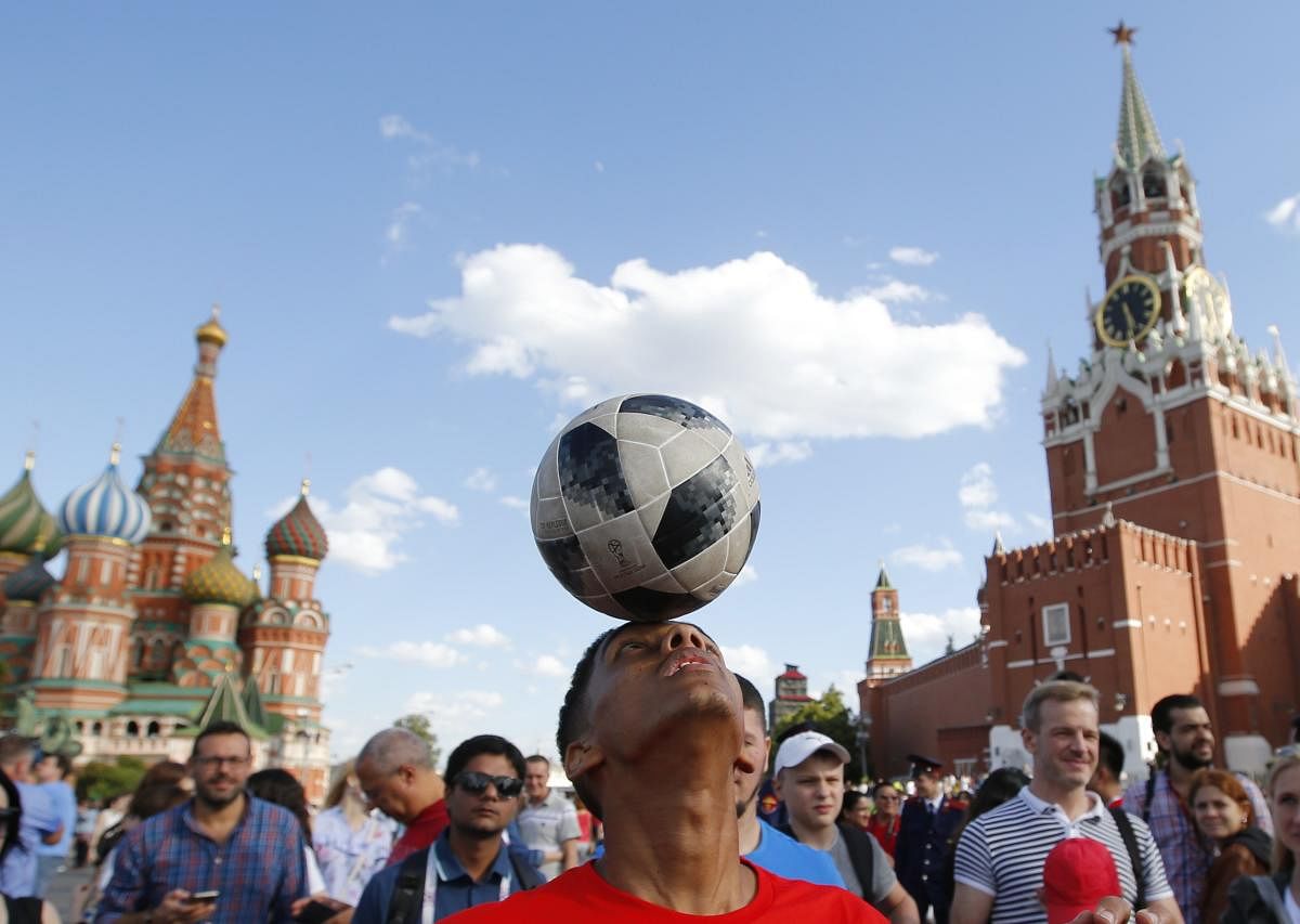 Soccer Football - World Cup - Group B - Portugal vs Morocco - Moscow, Russia - June 20, 2018. Morocco soccer fan plays with the ball at the Red Square after the match REUTERS
