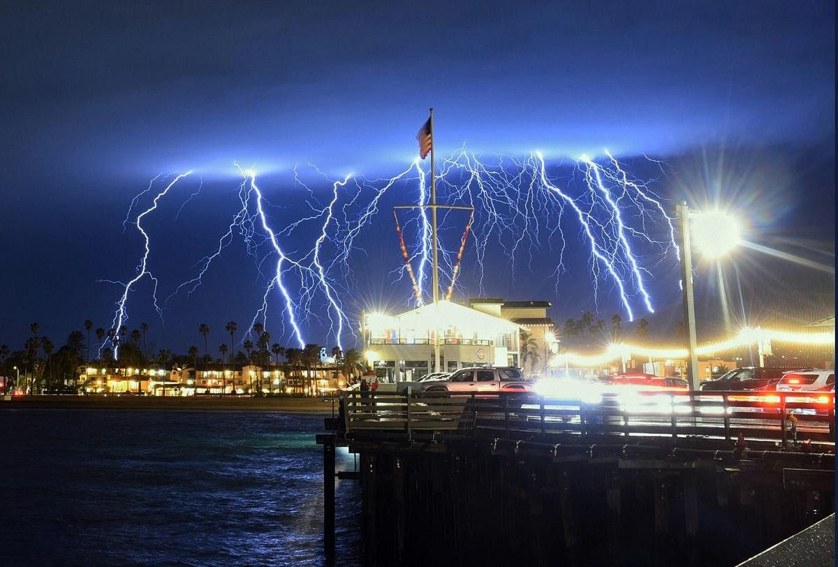 This time exposure photo provided by the Santa Barbara County Fire Department shows a series of lightning strikes over Santa Barbara, Calif., seen from Stearns Wharf in the city's harbor. AP/PTI