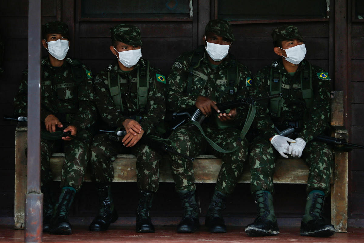 Brazilian army soldiers wearing protective face masks are seen, amid the spread of the coronavirus disease (COVID-19), at the 4th Surucucu Special Frontier Platoon of the Brazilian army in the municipality of Alto Alegre, state of Roraima, Brazil. Credit/Reuters Photo
