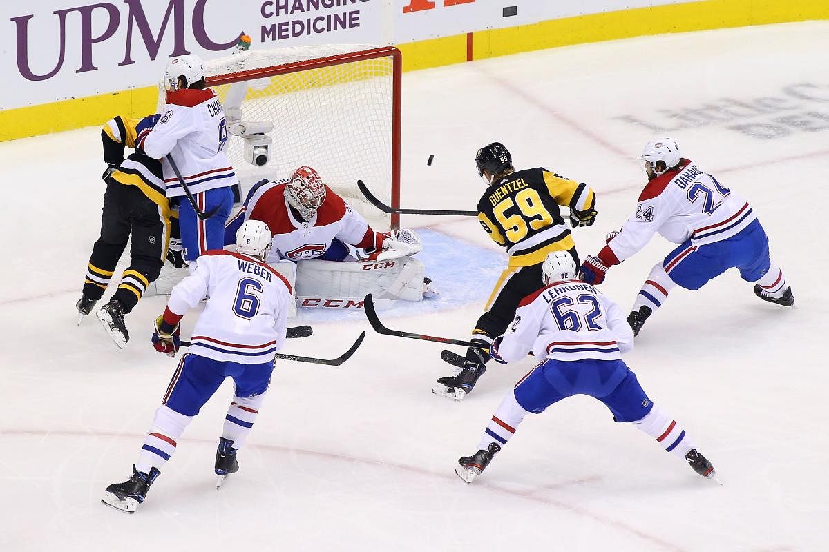 Carey Price #31 of the Montreal Canadiens makes a save against Jake Guentzel #59 of the Pittsburgh Penguins in Game Two of the Eastern Conference Qualification Round prior to the 2020 NHL. Credit: AFP