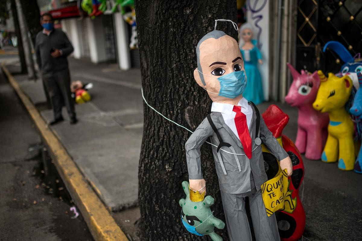 A pinata depicting Mexico's Vice Minister of Health of Mexico, Hugo Lopez-Gatell, is displayed for sale at a store in Mexico City. Credit: AFP