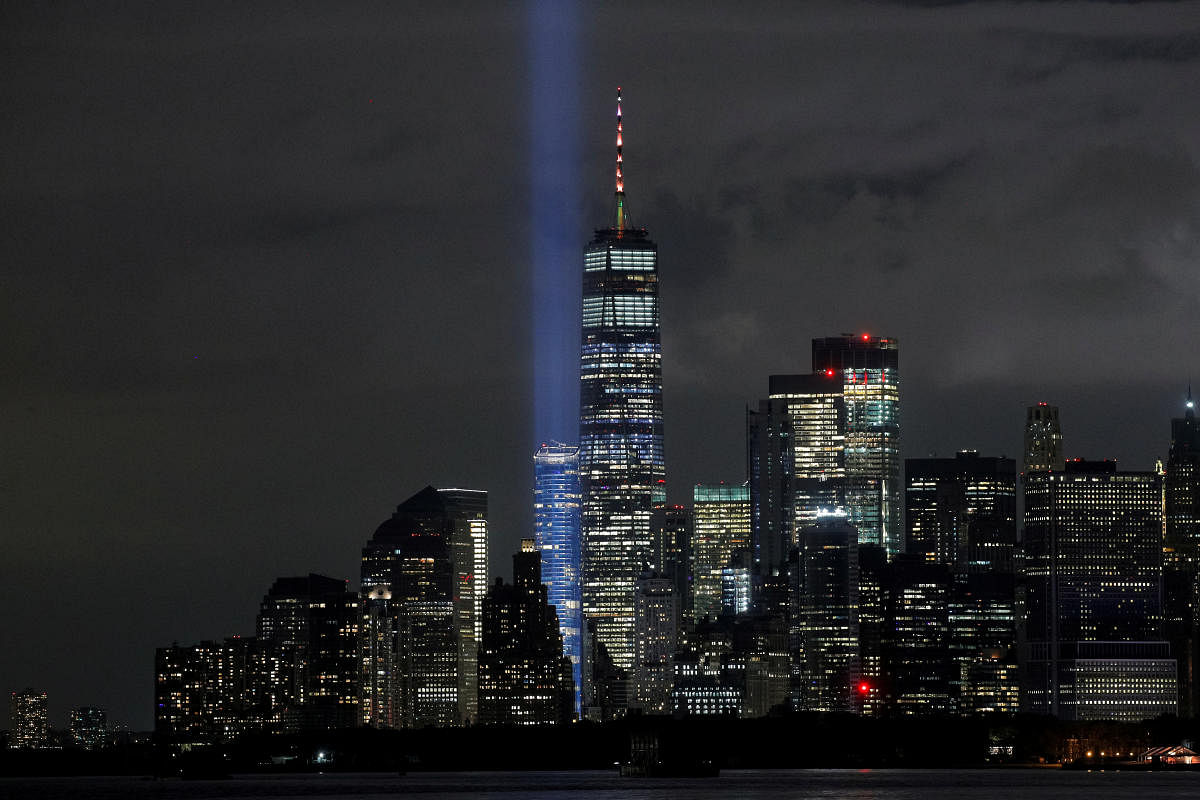 The Tribute in Light installation is tested over lower Manhattan and One World Trade Center, as seen from the borough of Brooklyn, the night before the 19th anniversary of the 9/11 attacks in New York City, US. Credit: Reuters Photo