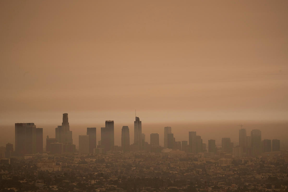 Record-shattering heat worsened this year’s fires in California. Scientists have said it is part of the region’s increasingly extreme swings between hot and dry weather, when fires are likely to start, and heavy rain that spurs the growth of plants that becomes fuel for fires the next time the weather turns hot and dry. The downtown skyline is pictured amidst the smoke from the Bobcat fire in Los Angeles, California, US, September 10, 2020. Credit: Reuters Photo