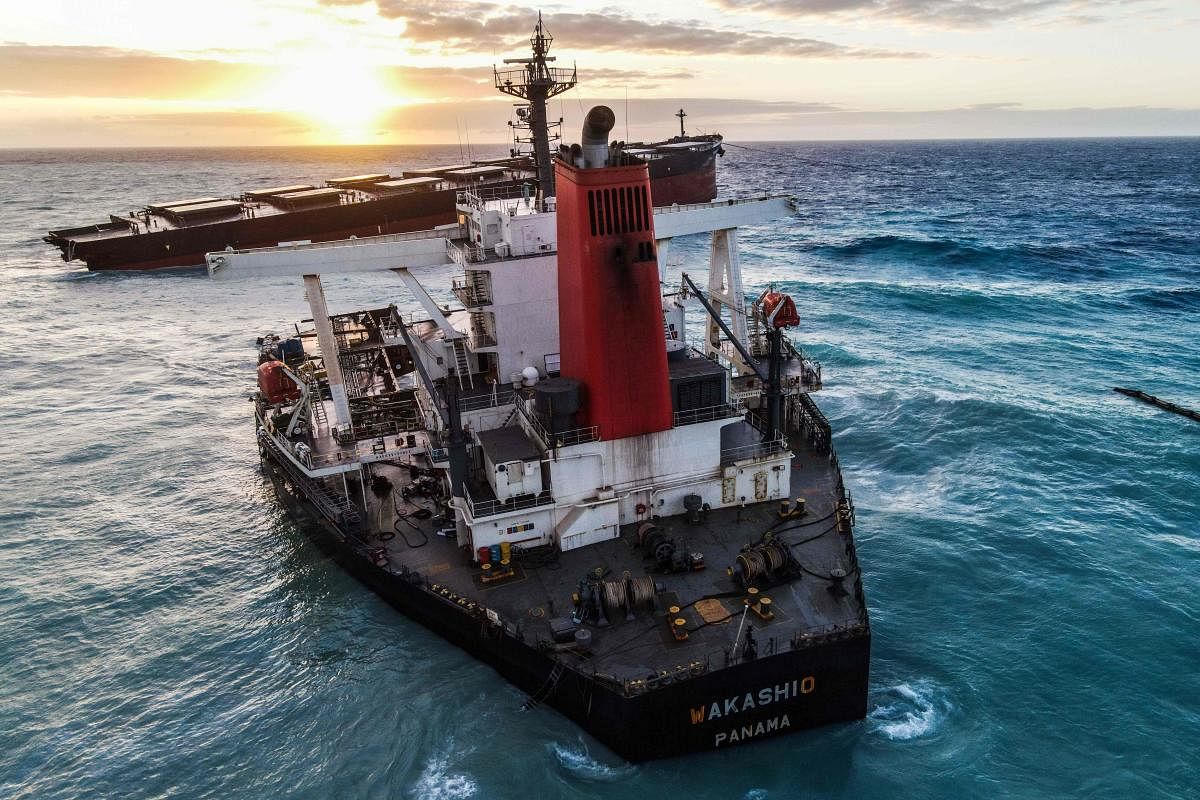 An aerial view taken in Mauritius shows the MV Wakashio bulk carrier, belonging to a Japanese company but Panamanian-flagged, that had run aground and broke into two parts near Blue Bay Marine Park. Credit: AFP