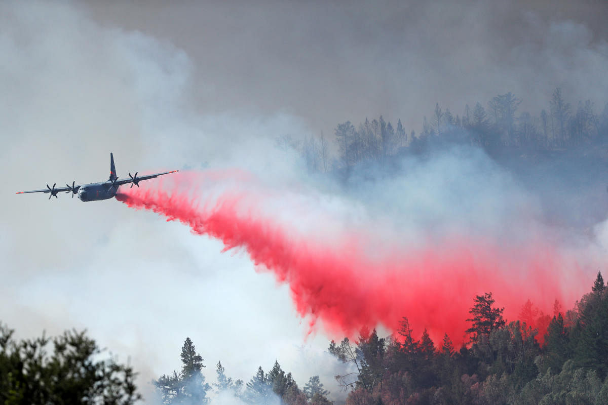 A California Air National Guard Modular Airborne Fire Fighting Systems (MAFFS) drops retardant ahead of the Glass Fire in Angwin, California, US. Credit: Reuters Photo