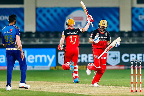 IPL 2020: Best moments from Royal Challengers Bangalore vs Mumbai Indians. RCB batsman AB de Villers and Devdutt Padikkal share a moment during the match. Credit: iplt20.com, BCCI