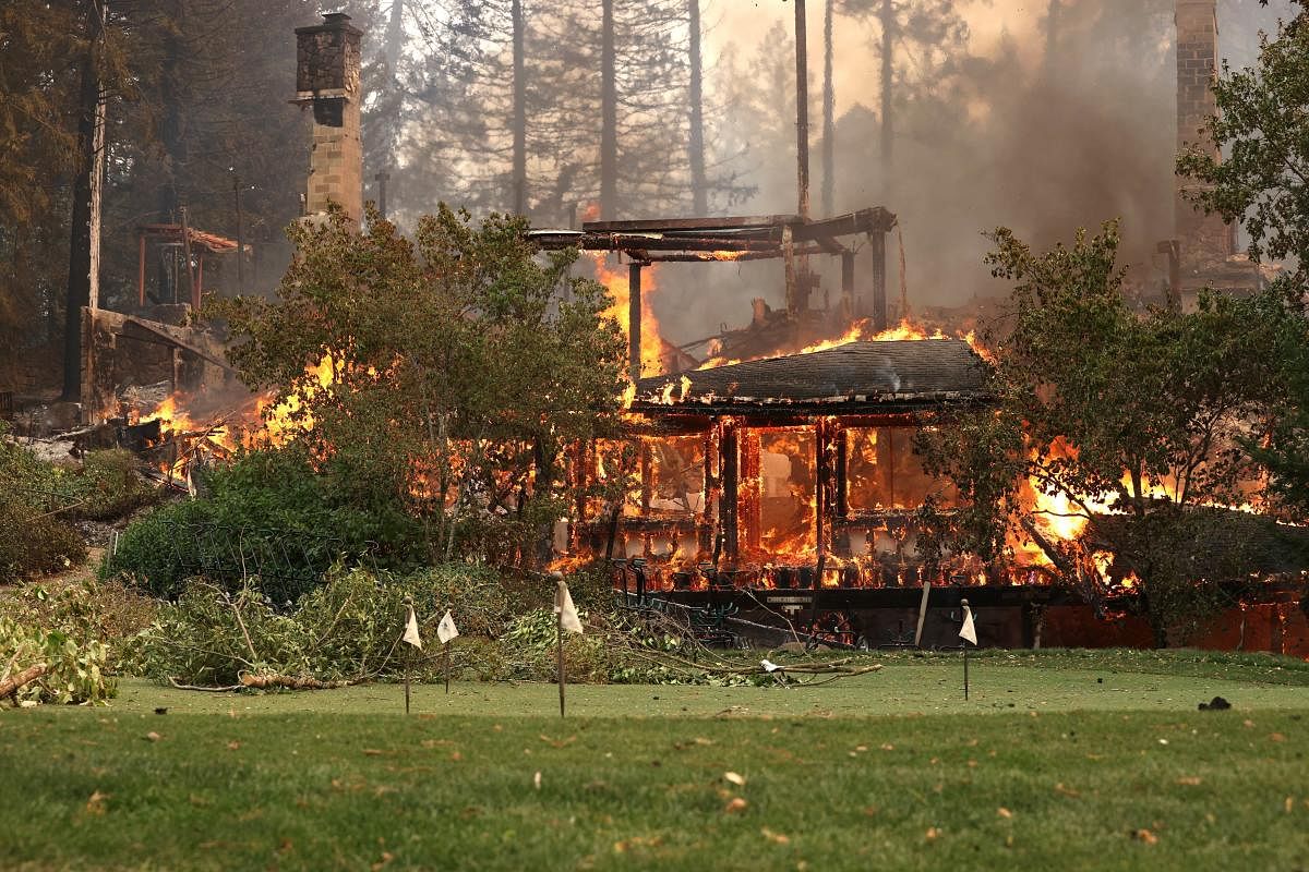 The main building and restaurant at Meadowood Napa Valley luxury resort burns after the Glass Incident Fire moved through St. Helena, California. The fast-moving Glass Incident, originally called the Glass Fire, has burned over 11,000 acres in Sonoma and Napa counties. Much of Northern California is under a red flag warning for high fire danger through Monday evening. Credit: AFP Photo