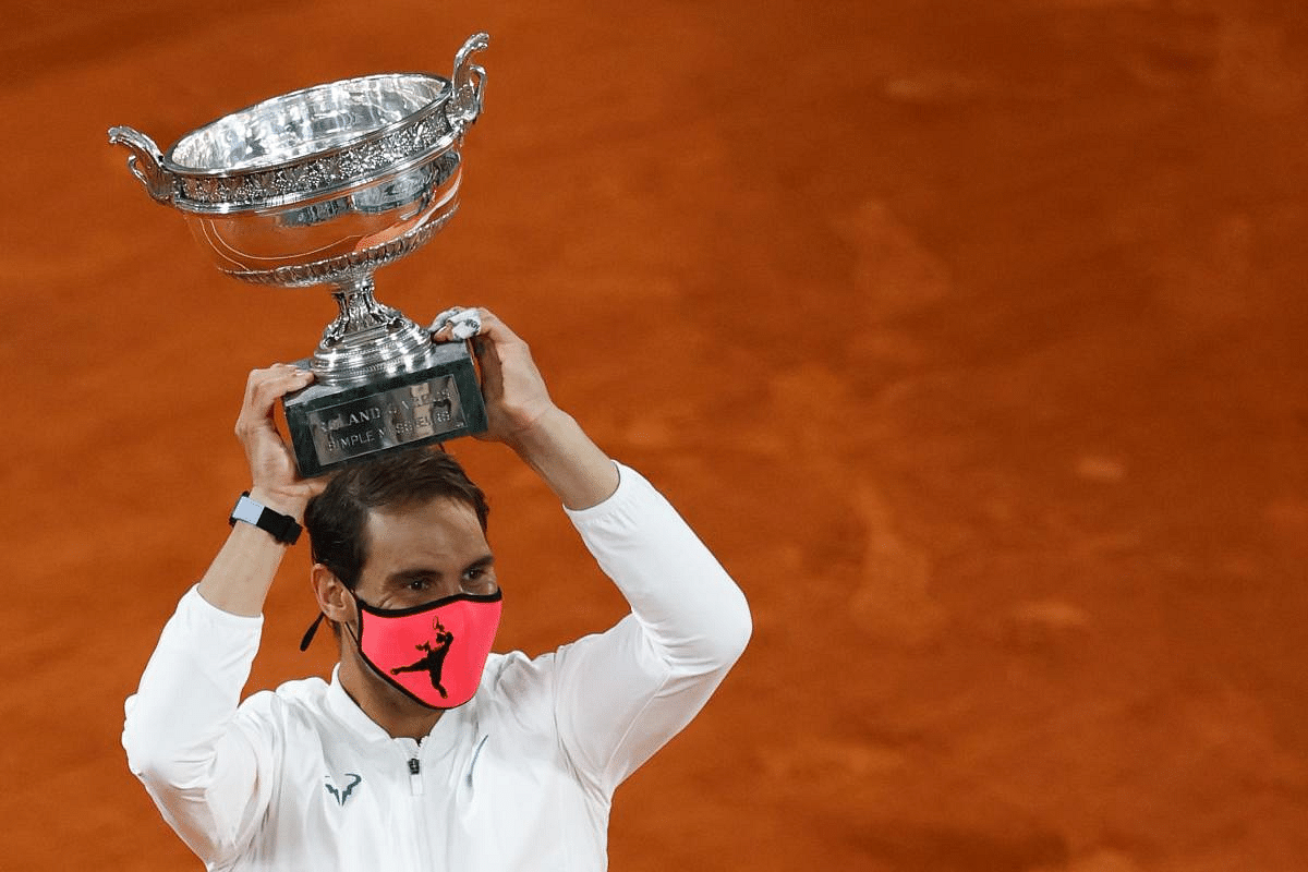 Spain's Rafael Nadal poses with the Mousquetaires Cup (The Musketeers) during the podium ceremony after winning the men's singles final tennis match against Serbia's Novak Djokovic at the Philippe Chatrier court, on Day 15 of The Roland Garros 2020 French Open tennis tournament in Paris. Credit: AFP Photo 