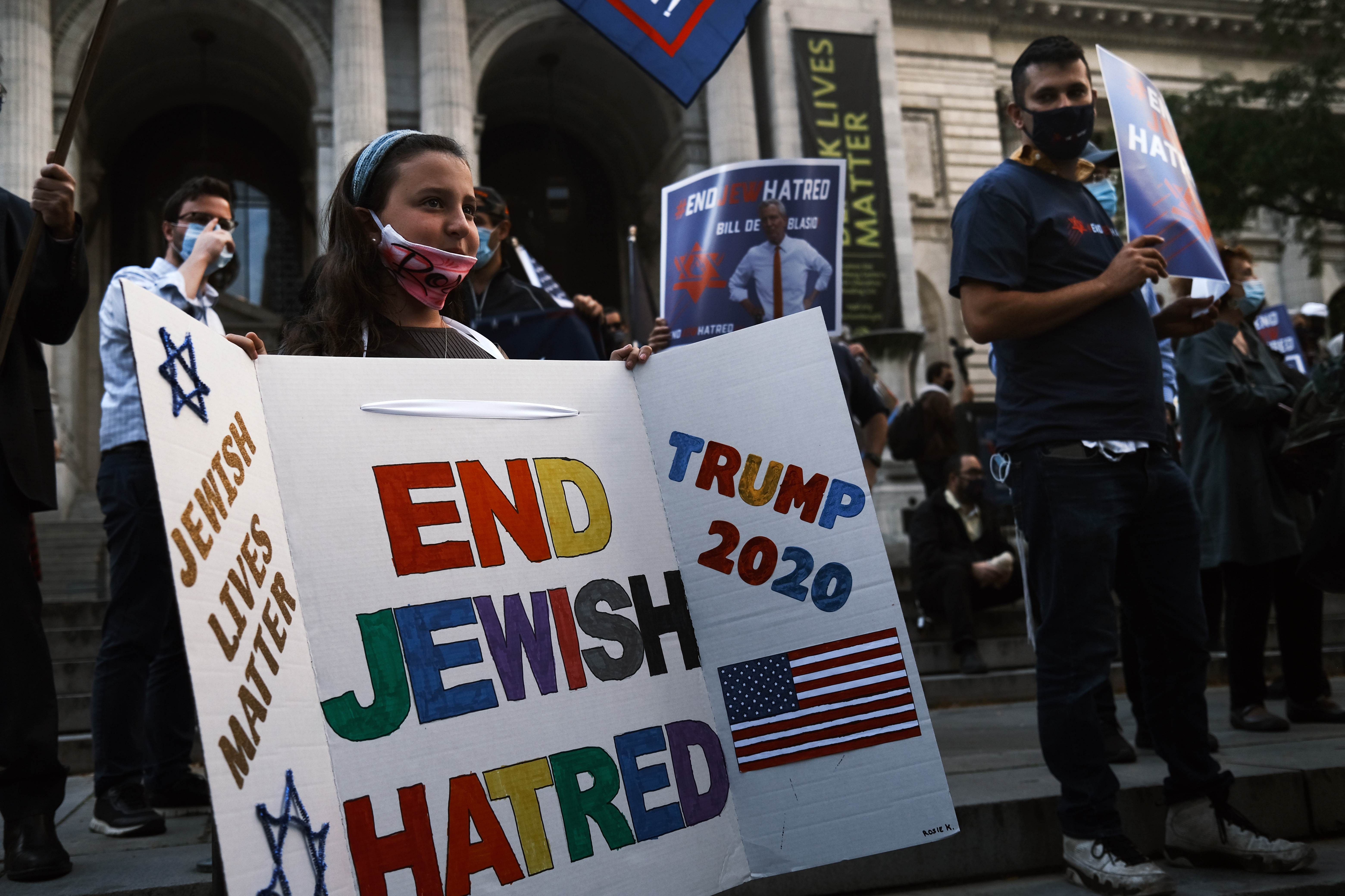 Protesters rally in Manhattan against the closing of some schools and businesses in Jewish neighborhoods in the Brooklyn and Queens boroughs due to a spike in the numbers of Covid-19 cases in these neighborhoods. Credit: AFP Photo