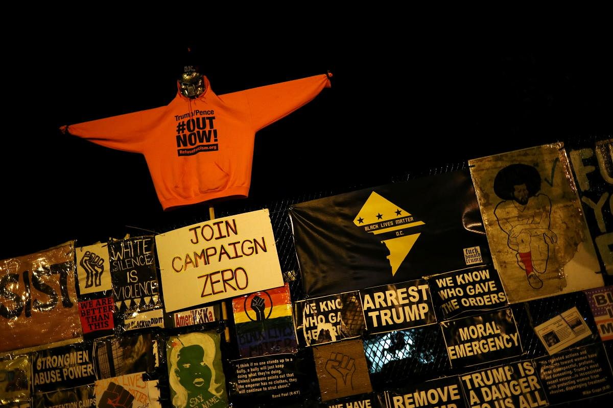 A hoodie with an anti-Trump message is put up on a fence at Black Lives Matter Plaza on the eve of the US presidential election in Washington, US. Credit: Reuters Photo