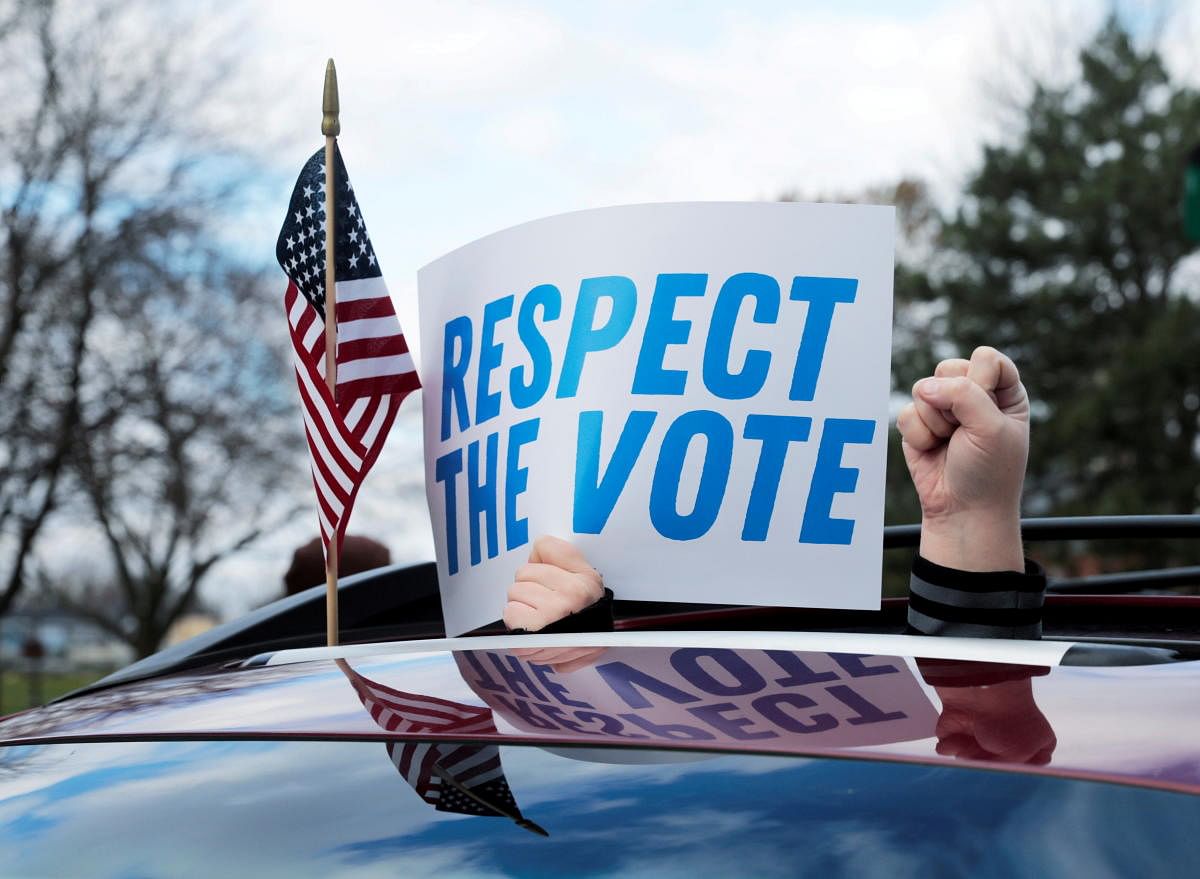 Demonstrators in a car caravan demand the Board of State Canvassers to certify the results of the election in Lansing, Michigan, US. Credit: Reuters Photo