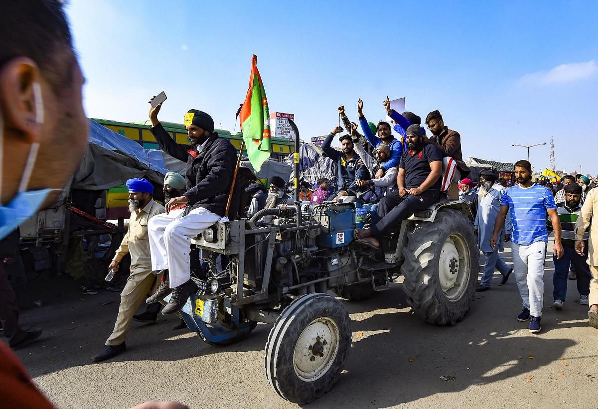 Farmers protest against the new farm laws, at Singhu border in New Delhi. Credit: PTI