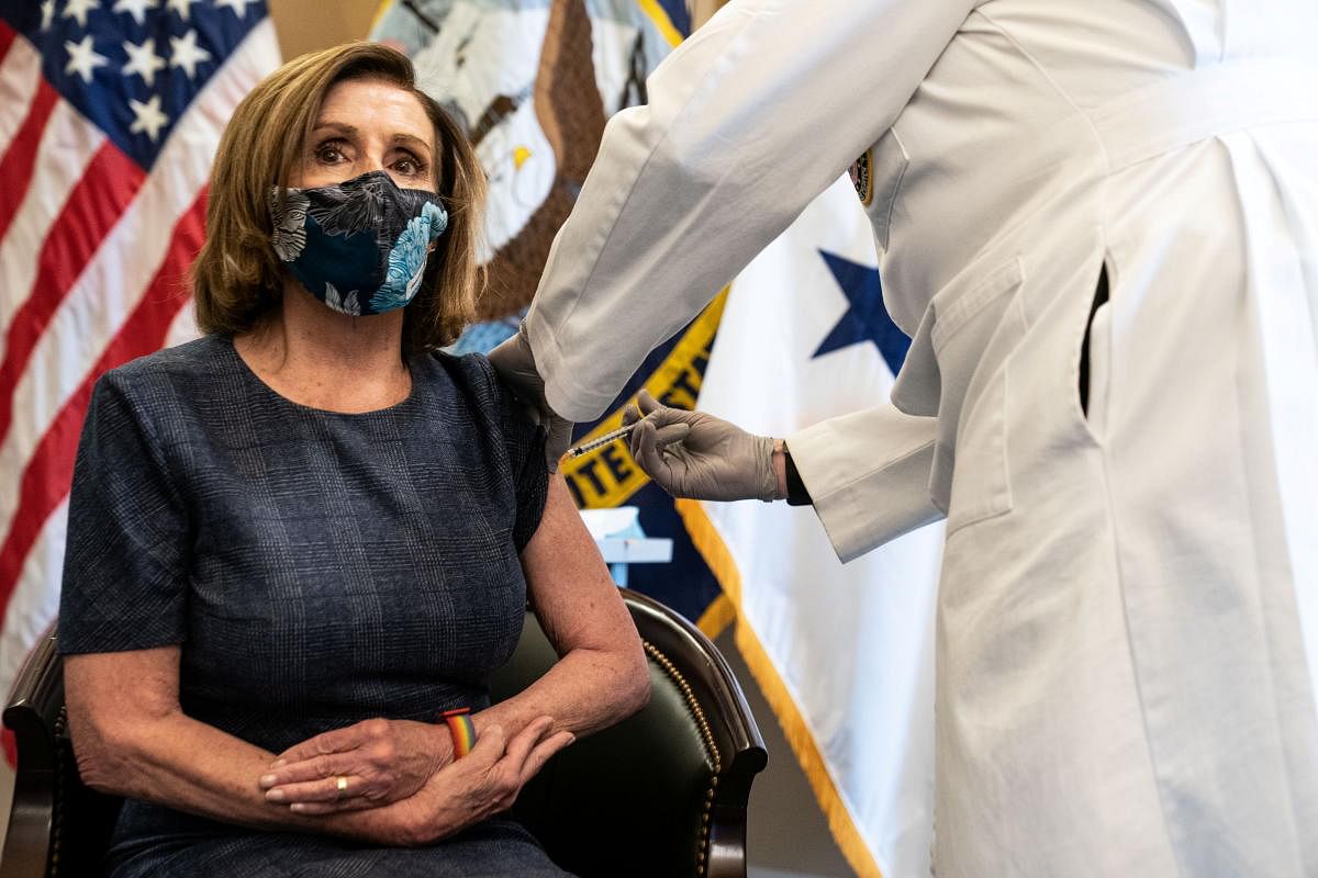US Speaker of the House Nancy Pelosi (D-CA) receives the Pfizer-BioNTech COVID-19 vaccine by Dr. Brian Monahan, attending physician of the United States Congress, at the Capitol in Washington, U.S., December 18, 2020. Credit: Reuters Photo