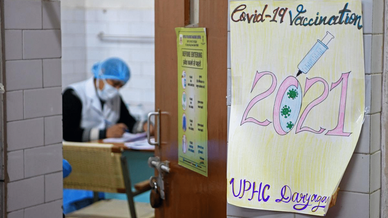 A health official takes part in dry run or a mock drill for Covid-19 coronavirus vaccine delivery at a health center in New Delhi. Credit: AFP Photo