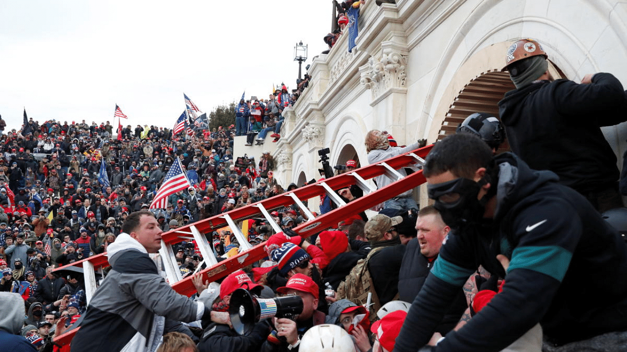 Pro-Trump protesters storm into the US Capitol during clashes with police, during a rally to contest the certification of the 2020 US presidential election results by the US Congress, in Washington, US. Credit: Reuters Photo