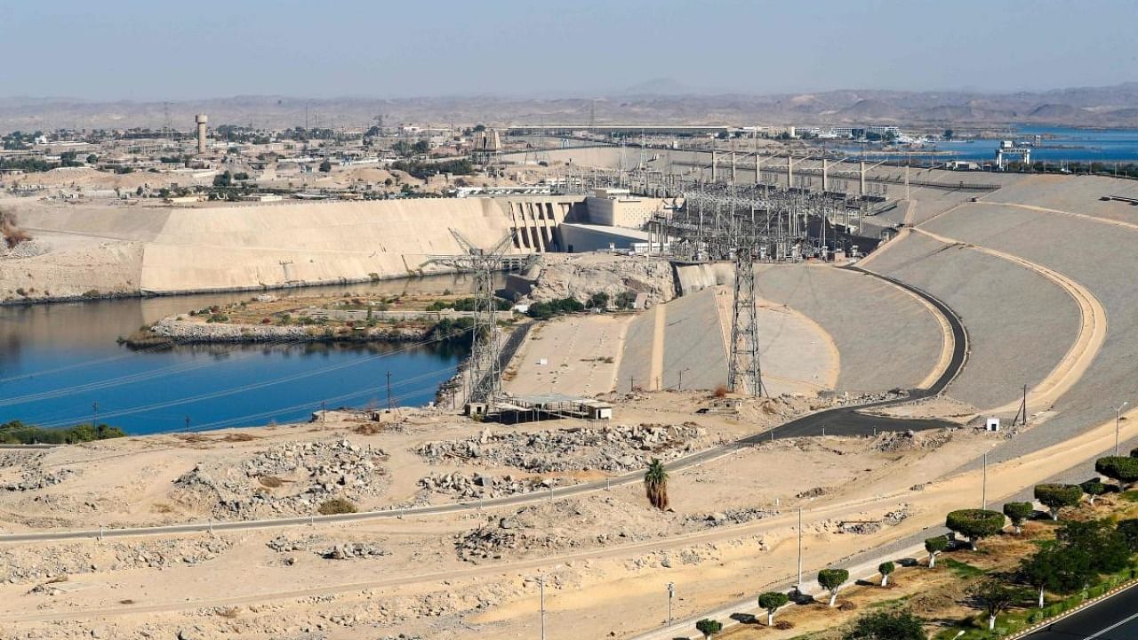 A picture taken on January 3, 2021 shows a general view of Egypt's High Dam in Aswan, some 920km south of the capital Cairo. - Half a century since Egypt's ground-breaking Aswan dam was inaugurated to fanfare, harnessing the Nile for hydropower and irrigation the giant barrier is still criticised for its human and environmental toll. Credit: AFP.