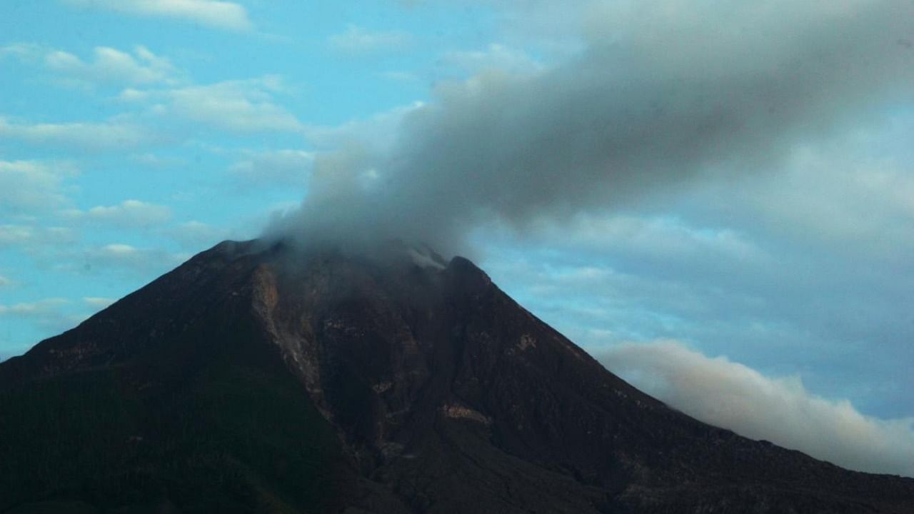 In this picture taken on January 23, 2021, Mount Sinabung spews smoke in Karo, North Sumatra. Credit: AFP.
