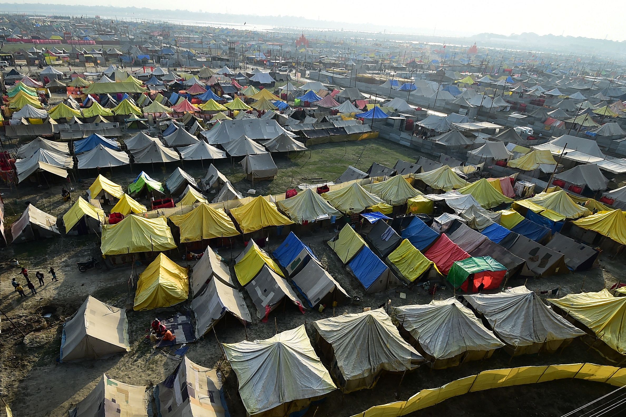 Temporary tents are seen as devotees arrived at Sangam, the confluence of the rivers Ganges, Yamuna and mythical Saraswati, during the annual Magh Mela festival in Allahabad on February 2, 2021. - Makeshift tens are erected at the Sangam, the confluence of the rivers Ganges, Yamuna and mythical Saraswati. Credit: AFP Photo