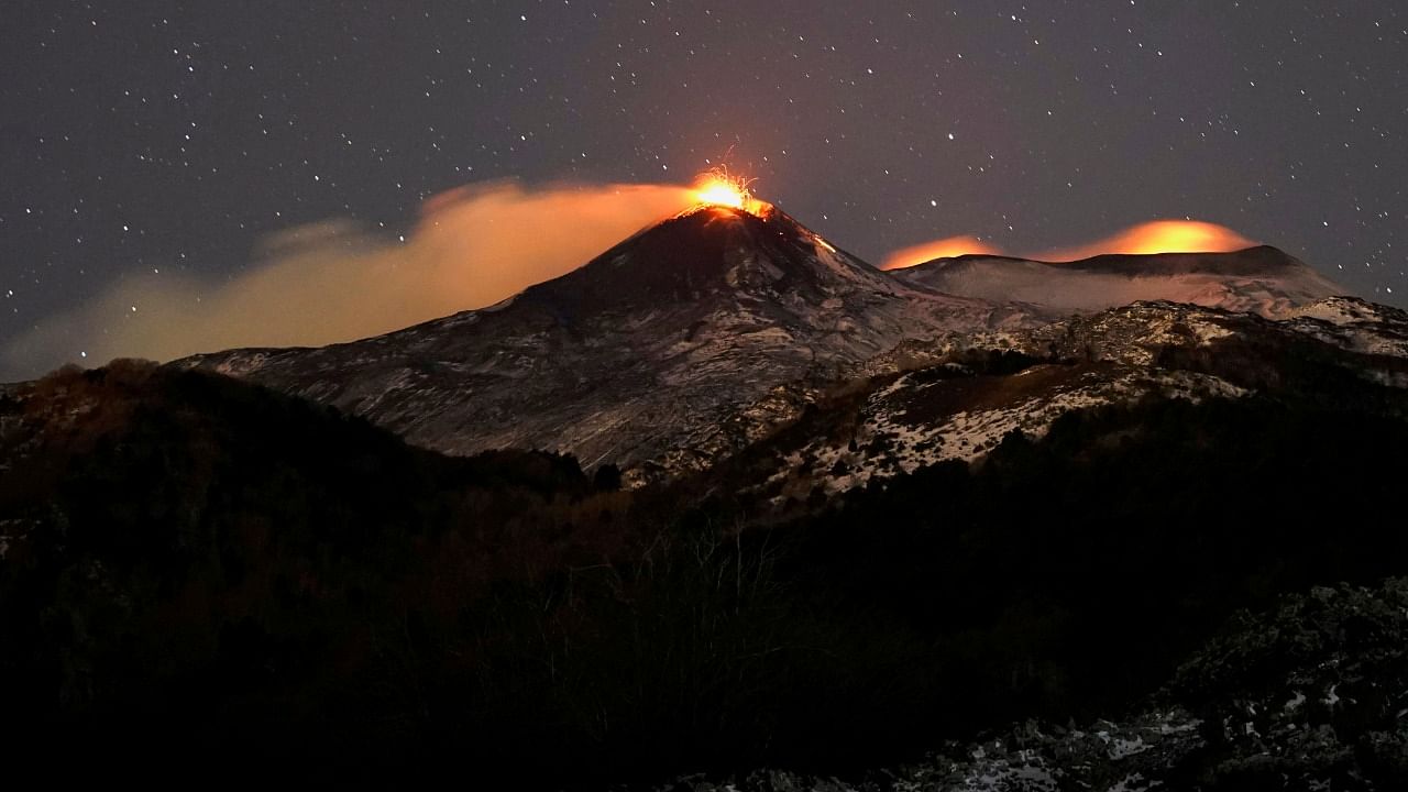Large streams of red hot lava shoot into the night sky as Mount Etna, Europe's most active volcano, leaps into action, seen from the village of Fornazzo, in Catania, Italy. Credit: AFP Photo