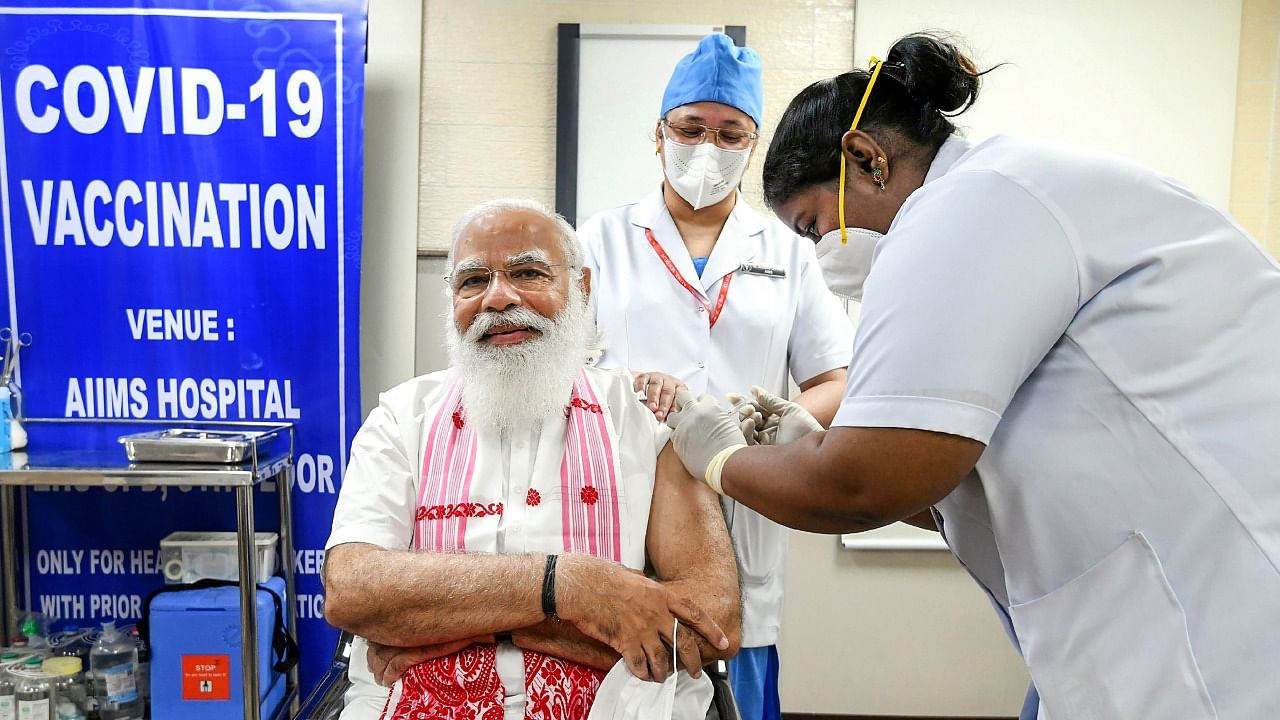 Prime Minister Narendra Modi being receives the first dose of Covid-19 vaccine, at AIIMS in New Delhi. Credit: PTI Photo