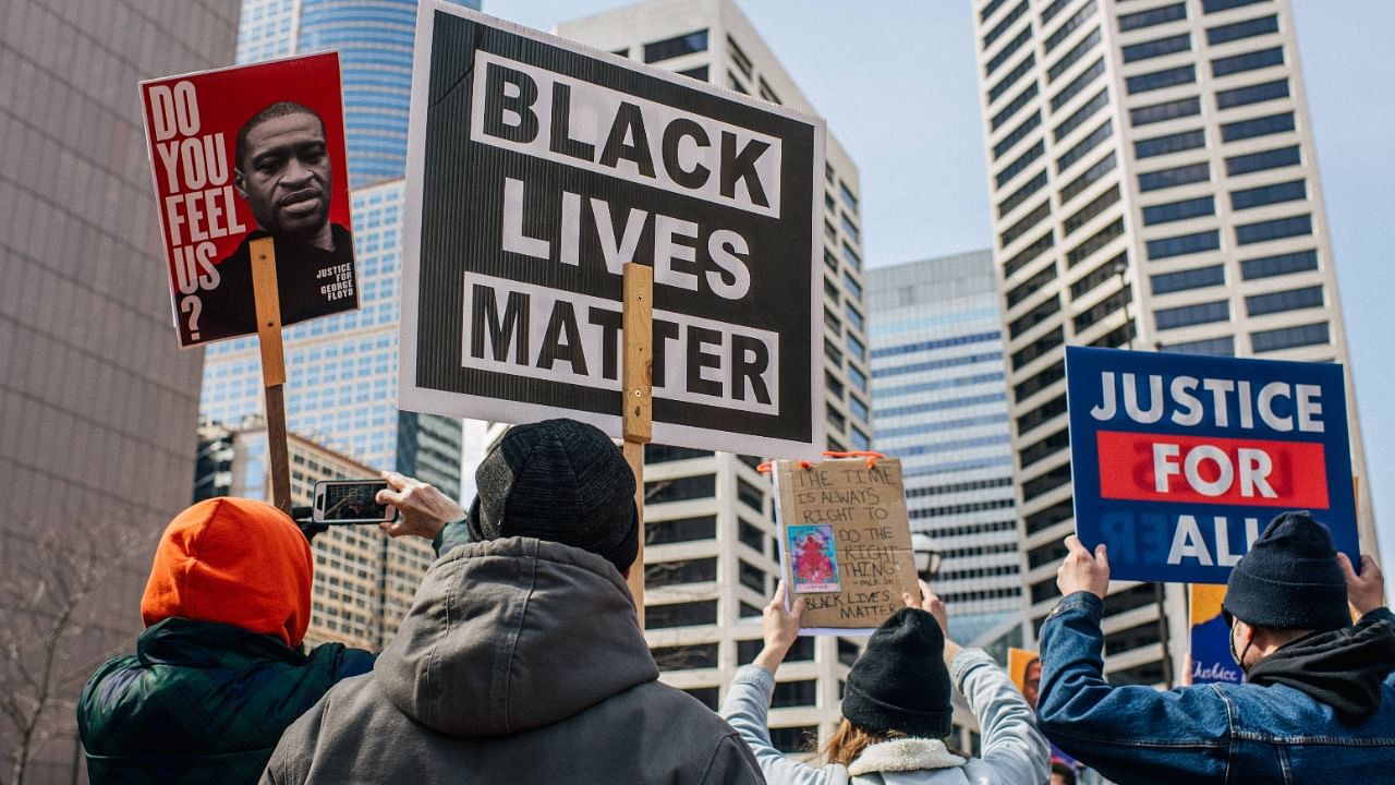 Demonstrators rally in front of the Hennepin County Government Center on March 28, 2021 in Minneapolis, Minnesota. Community members continue demonstrations ahead of opening statements in the trial of former Minneapolis police officer Derek Chauvin, who faces a second-degree murder charge in the death of George Floyd. Credit: AFP Photo