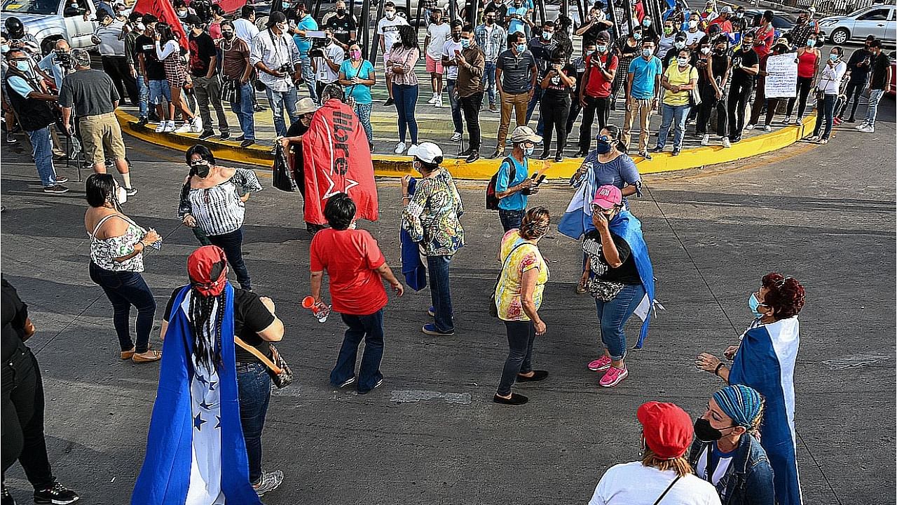 Honduran President Juan Orlando Hernandez's brother was sentenced to life in prison by a New York judge Tuesday for large-scale drug trafficking after a trial that implicated the leader of the Central American country. Credit: AFP Photo