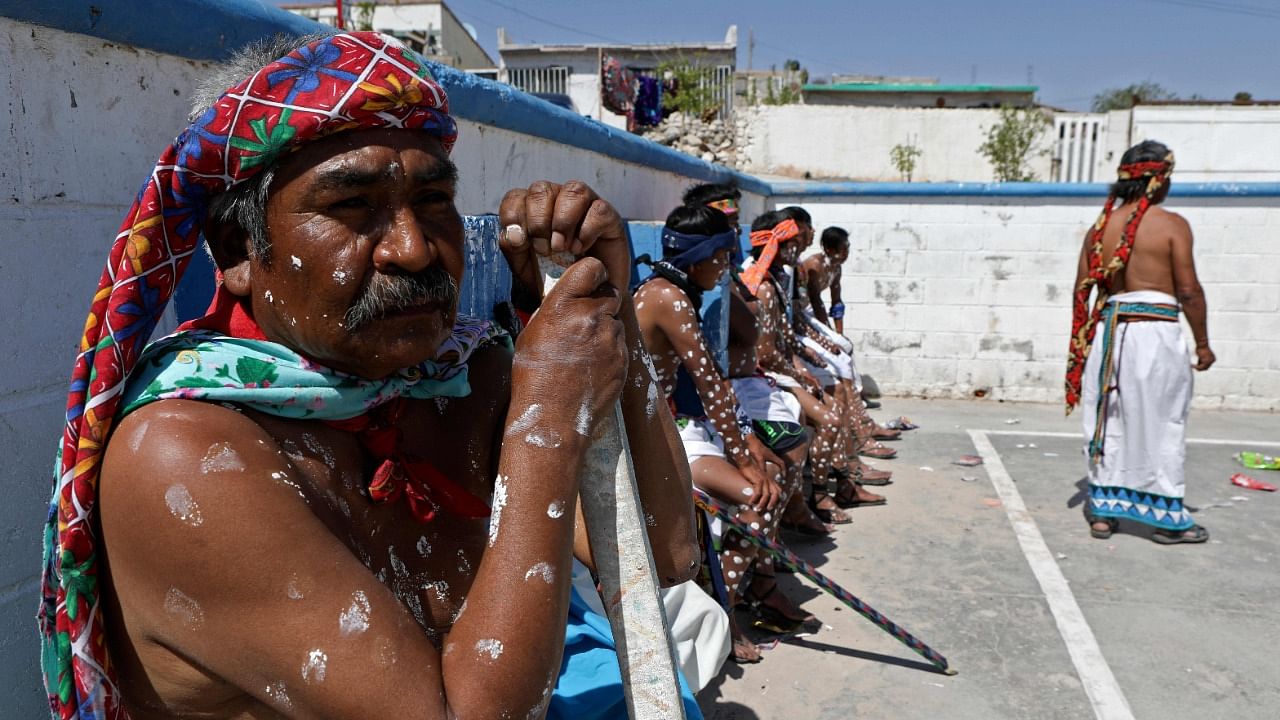 Members of the Raramuri ethnic group take part in Good Friday celebrations at the Tarahumara neighborhood in Ciudad Juarez, Chihuahua state, Mexico. Credit: AFP Photo