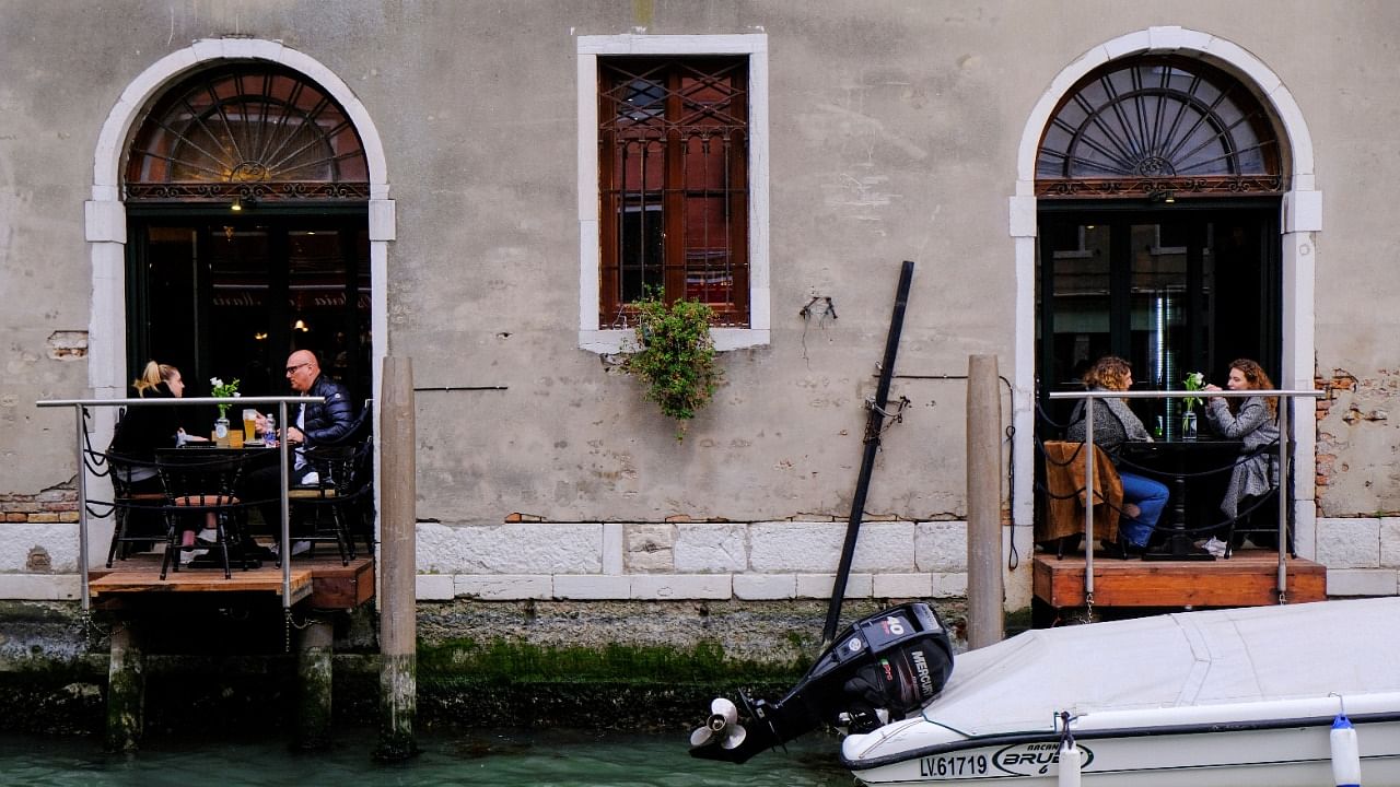 Bars and restaurants reopen as Italy eases Covid-19 restrictions, in Venice. Credit: Reuters Photo