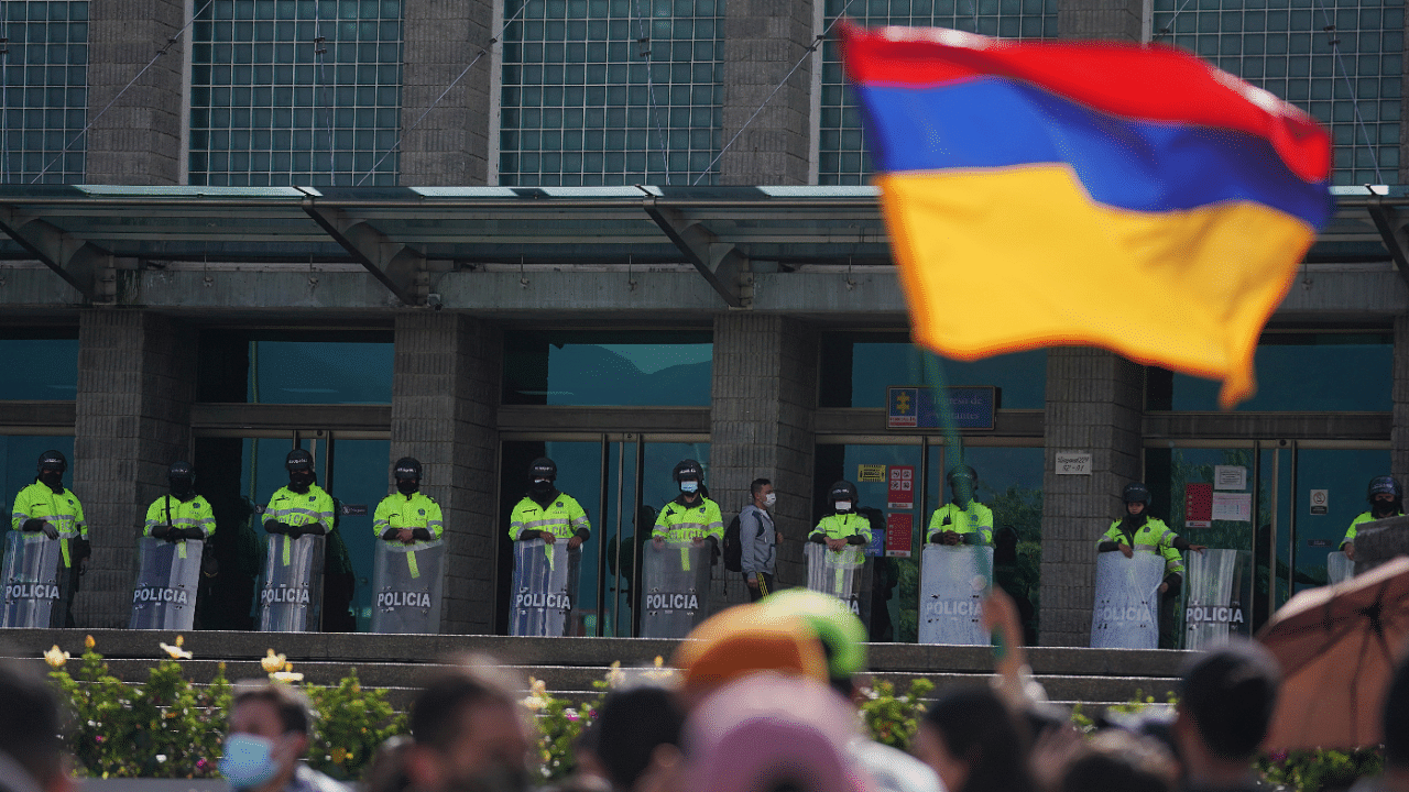 Demonstrators gather outside the Attorney General's Office during a protest demanding government action to tackle poverty, police violence and inequalities in the health and education systems, in Bogota, Colombia. Credit: Reuters Photo