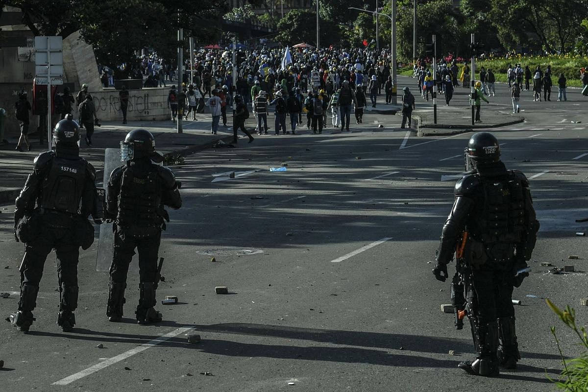 Demonstrators confront riot police during a new protest against the government in Medellin, Colombia. Credit: AFP Photo