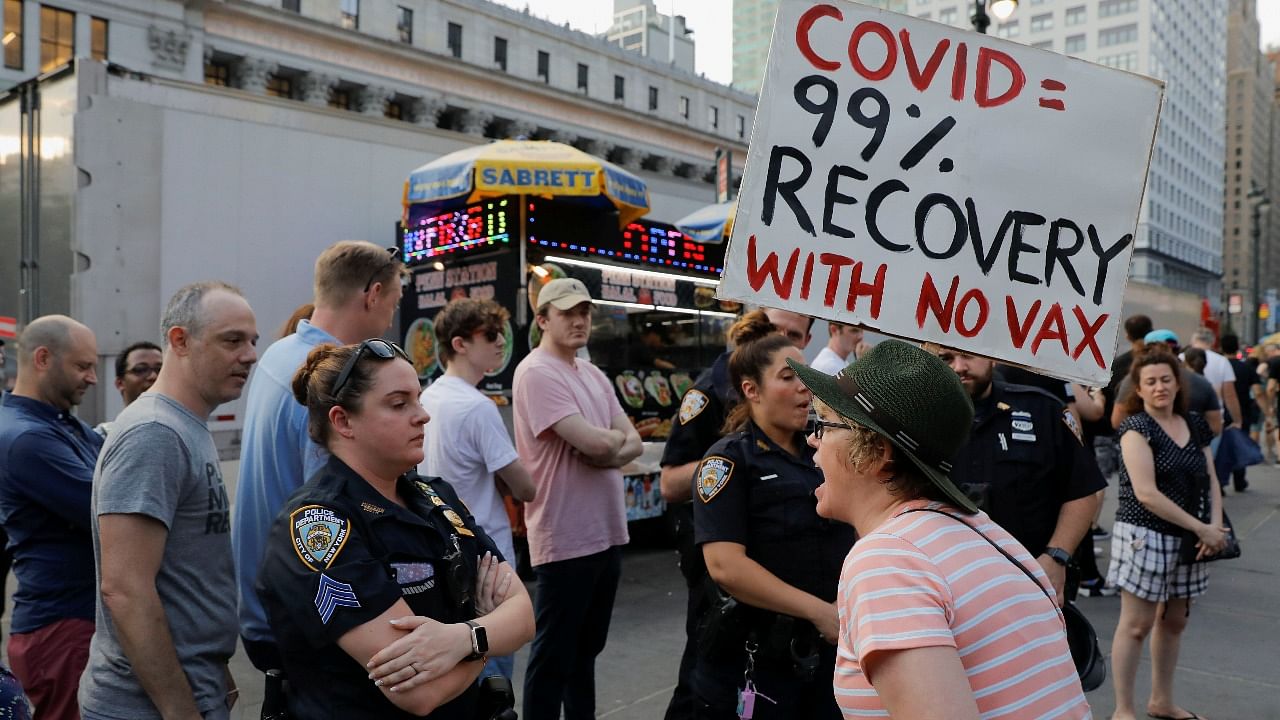 Anti-vaccine protesters gather outside Madison Square Garden ahead of a Foo Fighters' show, which required proof of vaccination to enter, in New York City. Credit: Reuters photo
