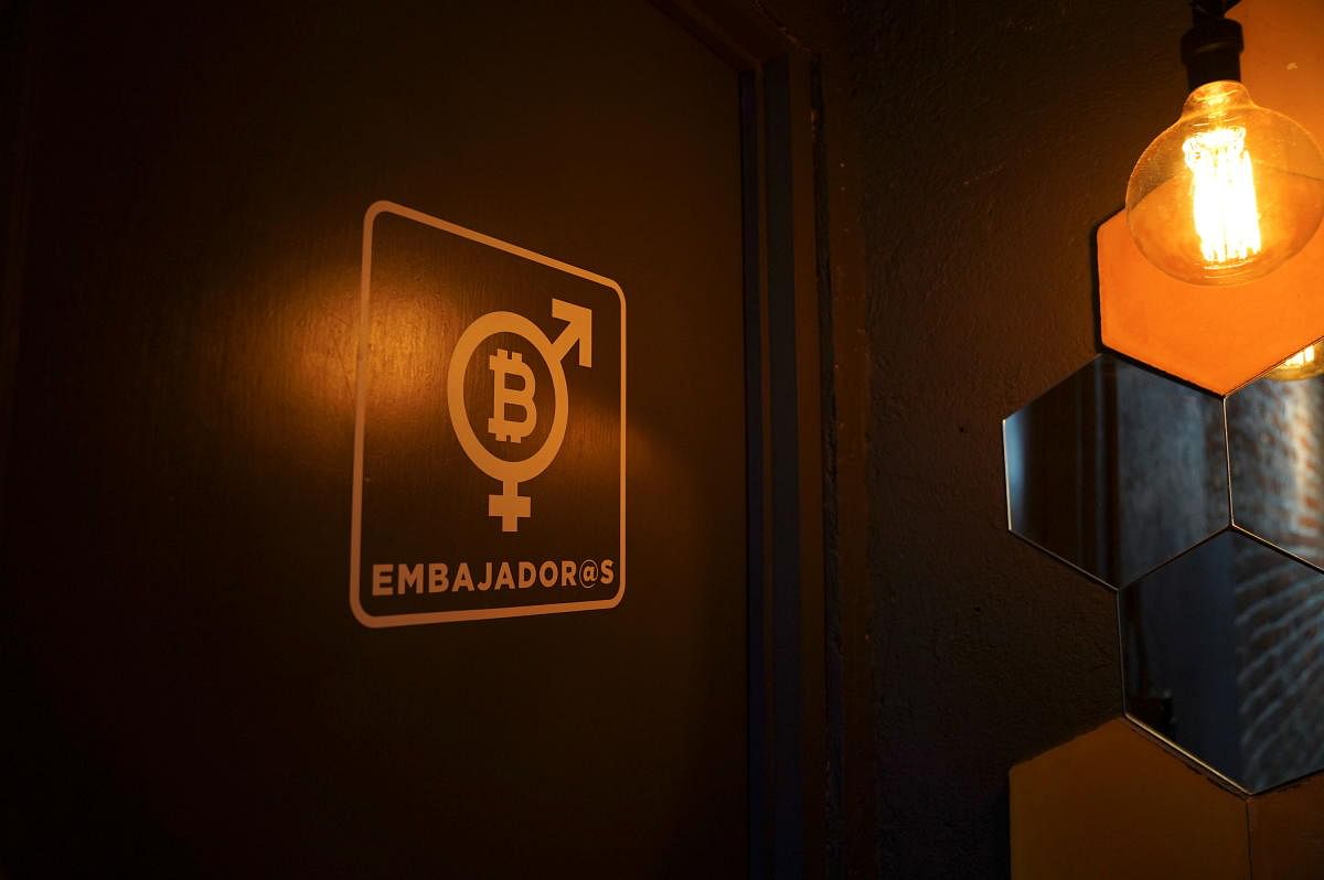 The logo of the virtual cryptocurrency Bitcoin is seen at a door at the Bitcoin Embassy bar. Credit: Reuters Photo