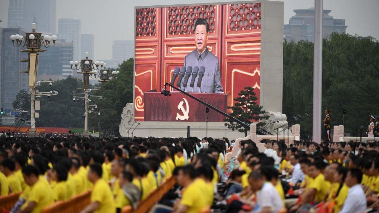 Chinese President Xi Jinping (on screen) delivers a speech during the celebrations of the 100th anniversary of the founding of the Communist Party of China at Tiananmen Square in Beijing on July 1, 2021. Credit: AFP Photo