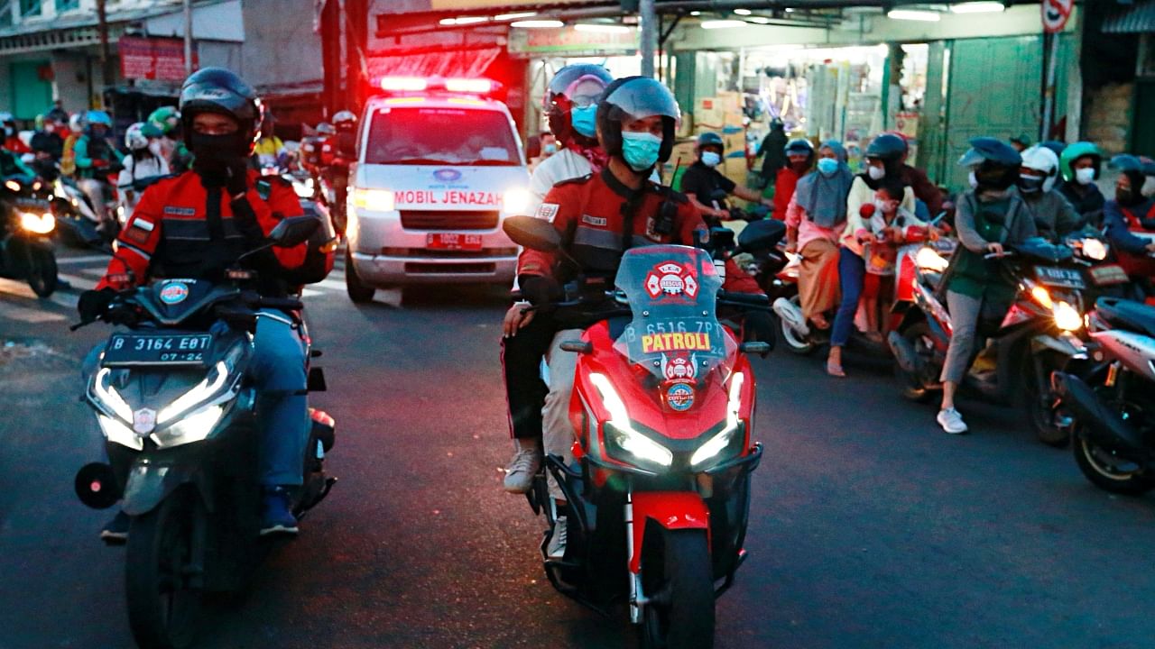 Bikers escort ambulances through traffic-choked Indonesia streets amid soaring Covid-19 infections