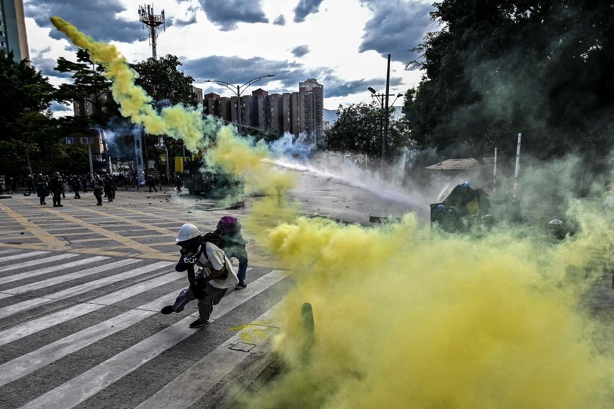 Demonstrators clash with riot police during a protest against the government of Colombian President Ivan Duque in Medellin, Colombia, amid Independence Day celebrations in the country. Credit: AFP Photo