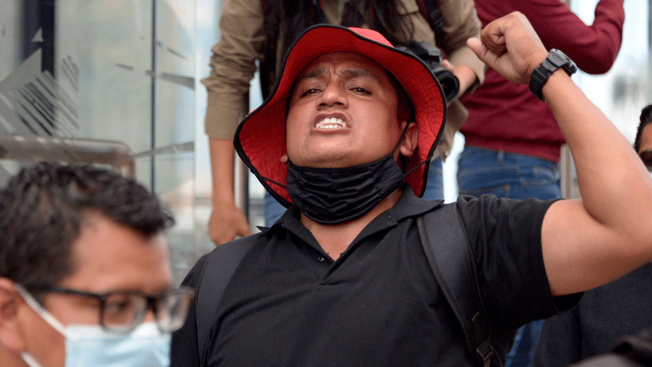 A member of the Unitary Front of Workers (FUT), the main union in Ecuador, shouts slogans during a march against the government of President Guillermo Lasso, for the increase in the price of fuel, in Quito. Credit: AFP Photo