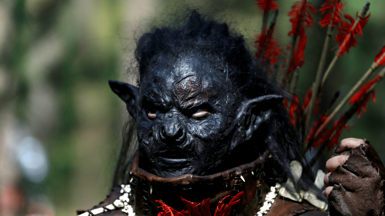 A participant dressed as a character from J.R.R. Tolkien's novel "The Hobbit" takes part in a reenactment of the "Battle of Five Armies" in a forest near Doksy. Credit: Reuters Photo