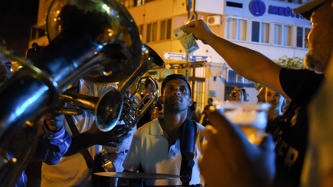 Musicians play their instruments during the annual brass band festival in Guca, Serbia. Credit: Reuters Photo